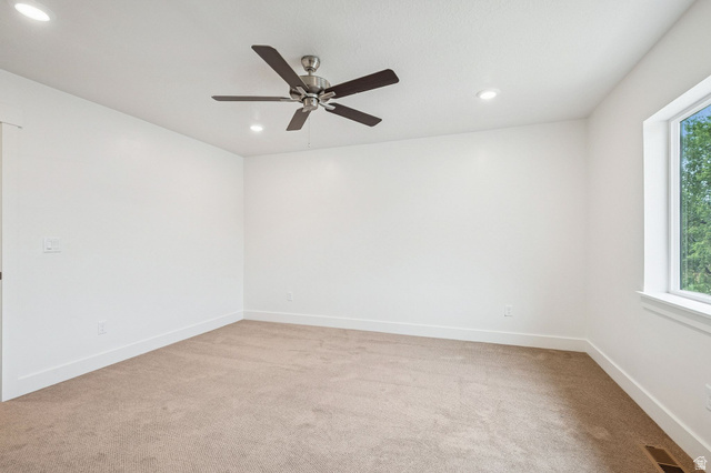 1627 North Angel Street Layton, UT 84041 - Photo 12 of 39 Unfurnished room with light colored carpet, a ceiling fan, and recessed lighting