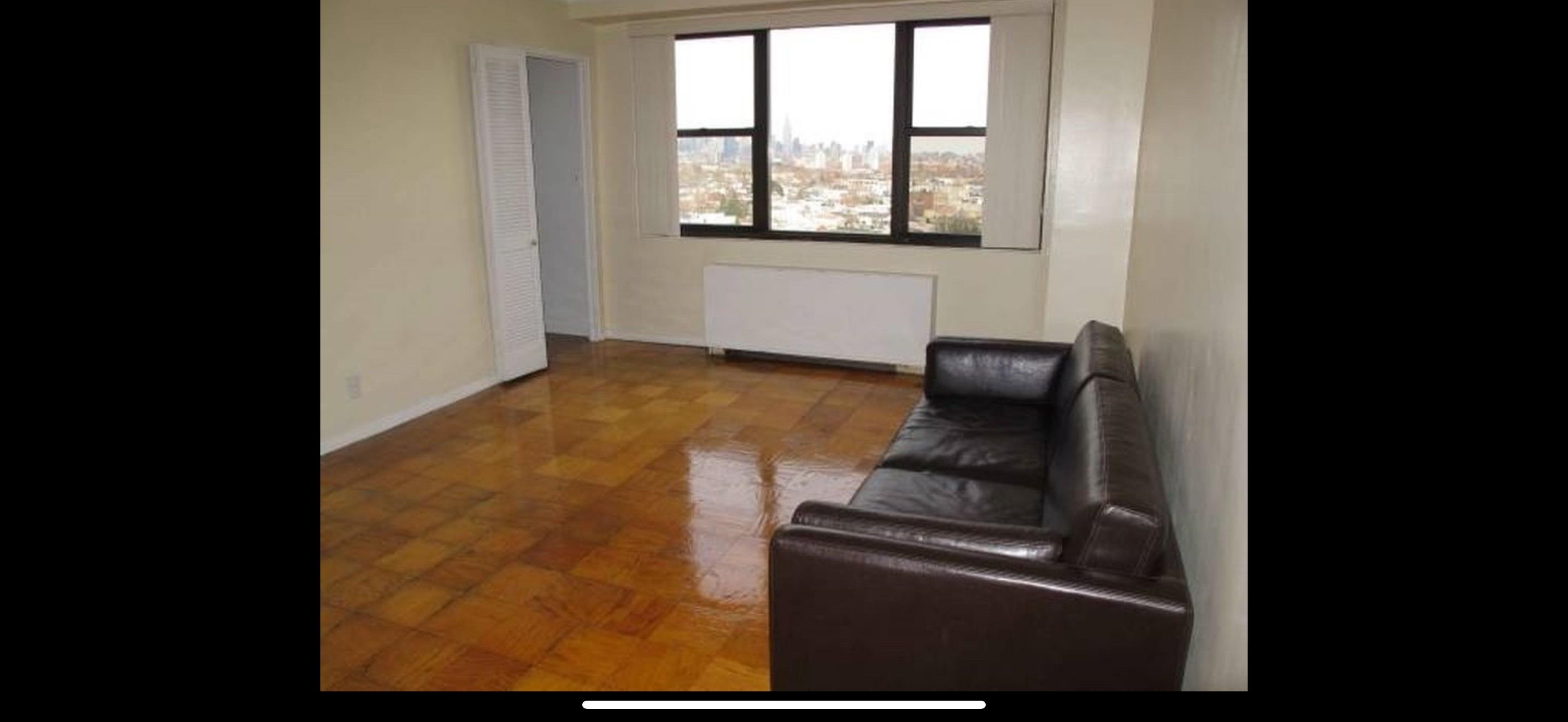 201 St Pauls Avenue, Unit 1502 Jersey City, NJ 07306 - Photo 3 of 6 a close view of a stove top oven and sitting space