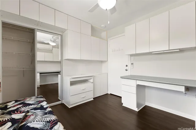 a kitchen with a appliances and cabinets