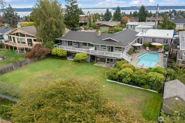 an aerial view of a house with garden space and street view