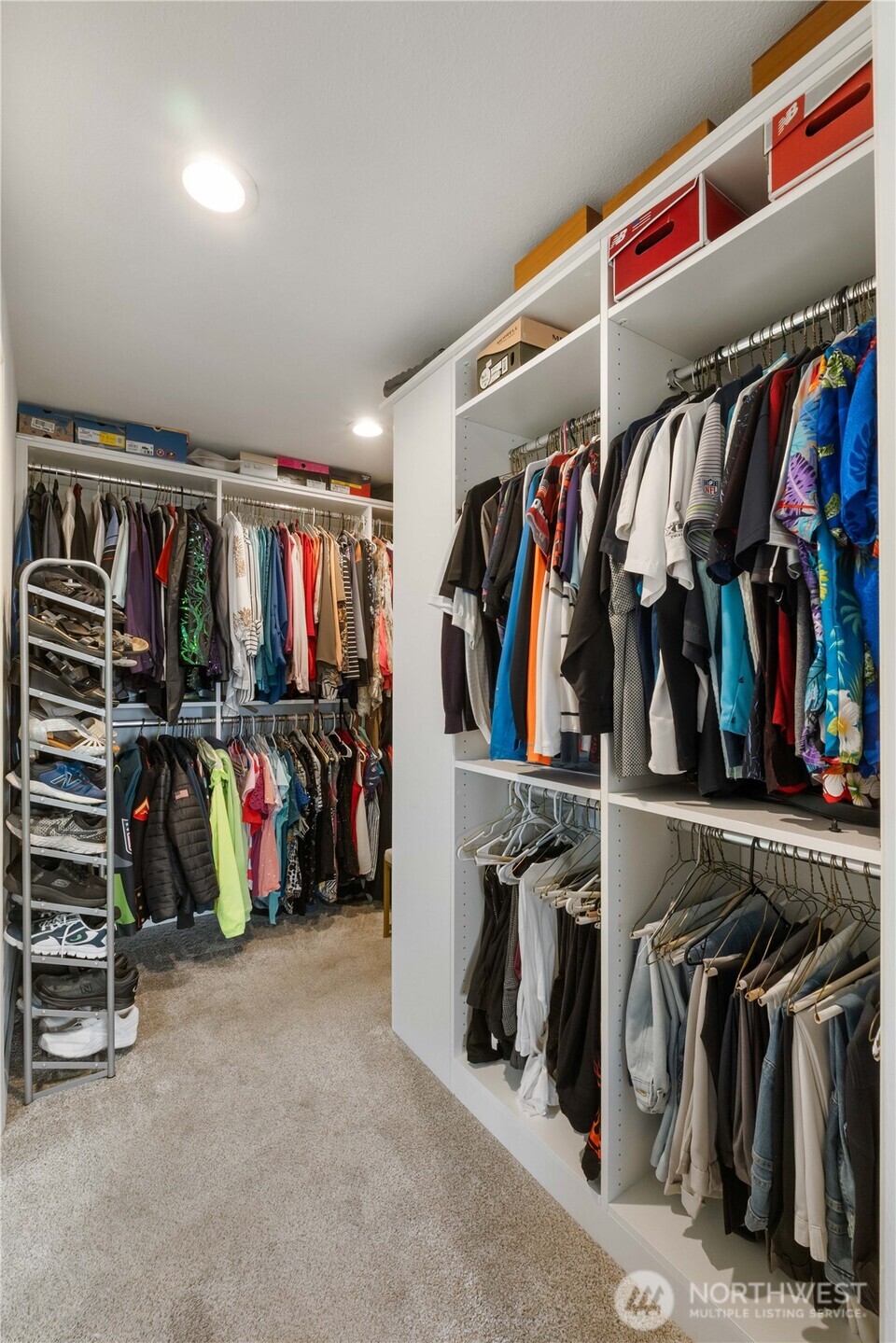4911 Mildred Street Tacoma, WA 98407 - Photo 19 of 40 a view of walk in closet with clothes and shoes