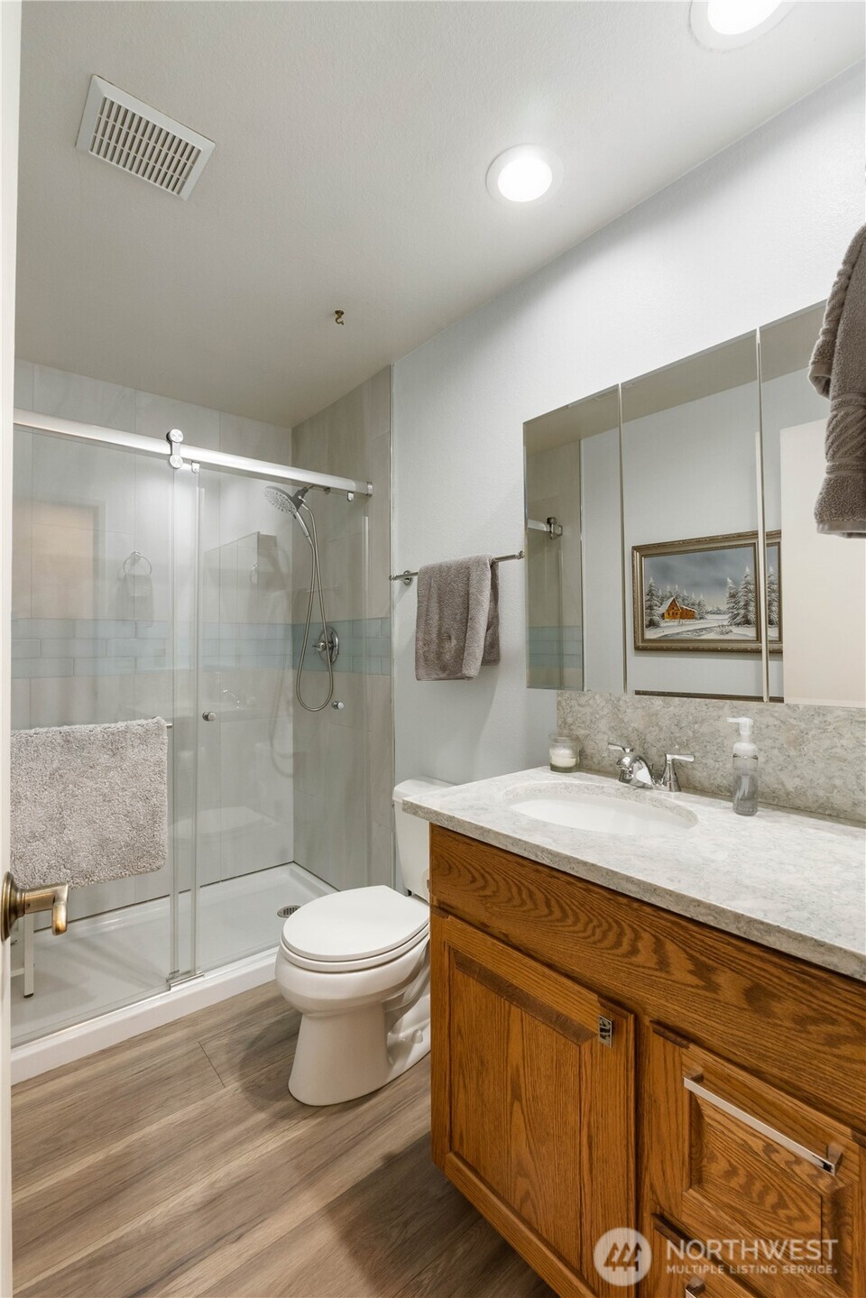 4911 Mildred Street Tacoma, WA 98407 - Photo 23 of 40 a bathroom with a granite countertop sink toilet and shower