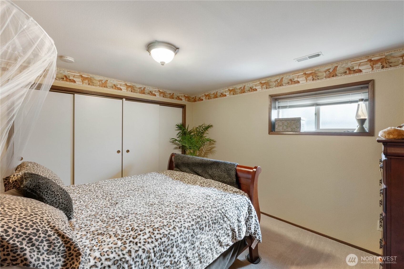 4911 Mildred Street Tacoma, WA 98407 - Photo 26 of 40 a bedroom with a bed and a window