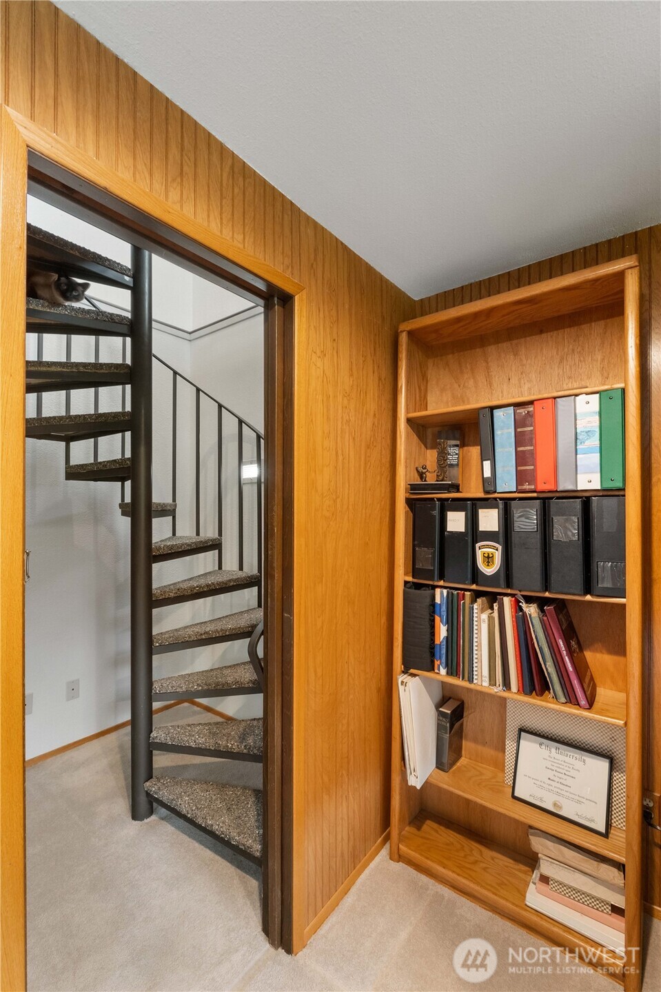4911 Mildred Street Tacoma, WA 98407 - Photo 28 of 40 a living room with furniture and a book shelf