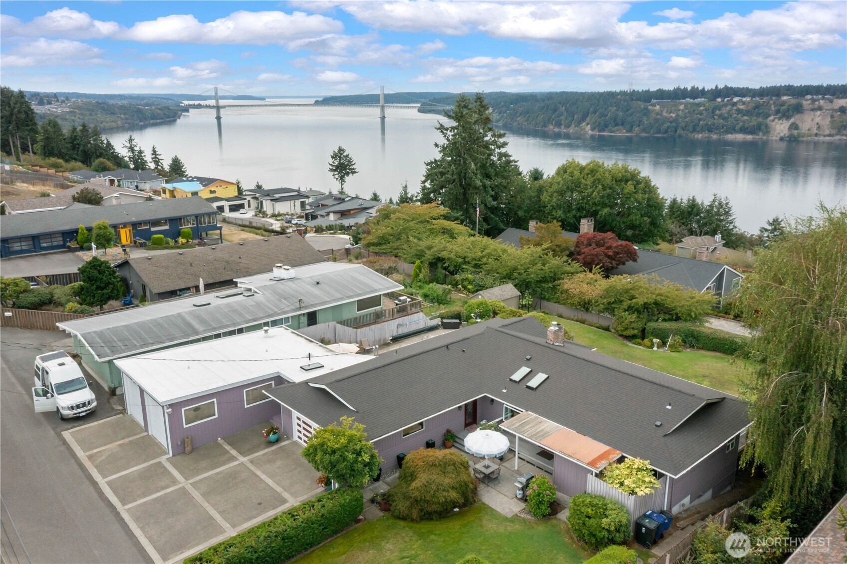 4911 Mildred Street Tacoma, WA 98407 - Photo 3 of 40 a view of a lake with a building in front of it