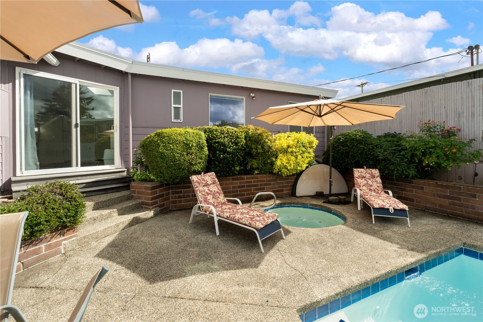 4911 Mildred Street Tacoma, WA 98407 - Photo 7 of 40 a backyard of a house with outdoor seating