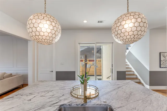 a view of entryway with a chandelier and wooden floor