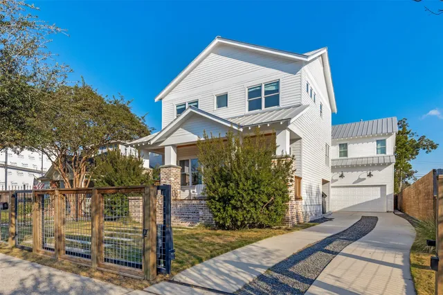 a front view of a house with yard