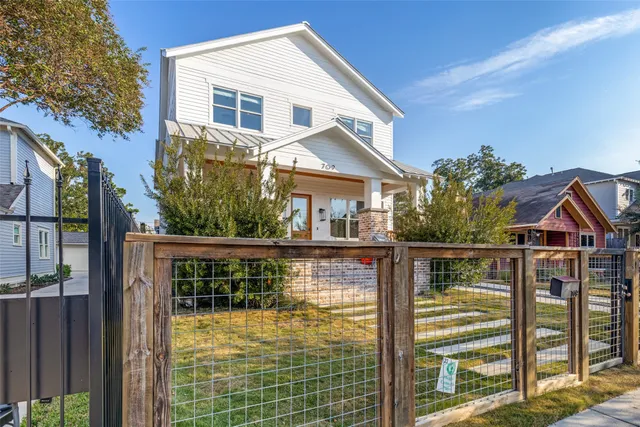 a balcony with table and chairs