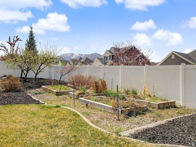117 Ridge View Drive Elk Ridge, UT 84651 - Photo 42 of 42 Fenced backyard featuring a garden