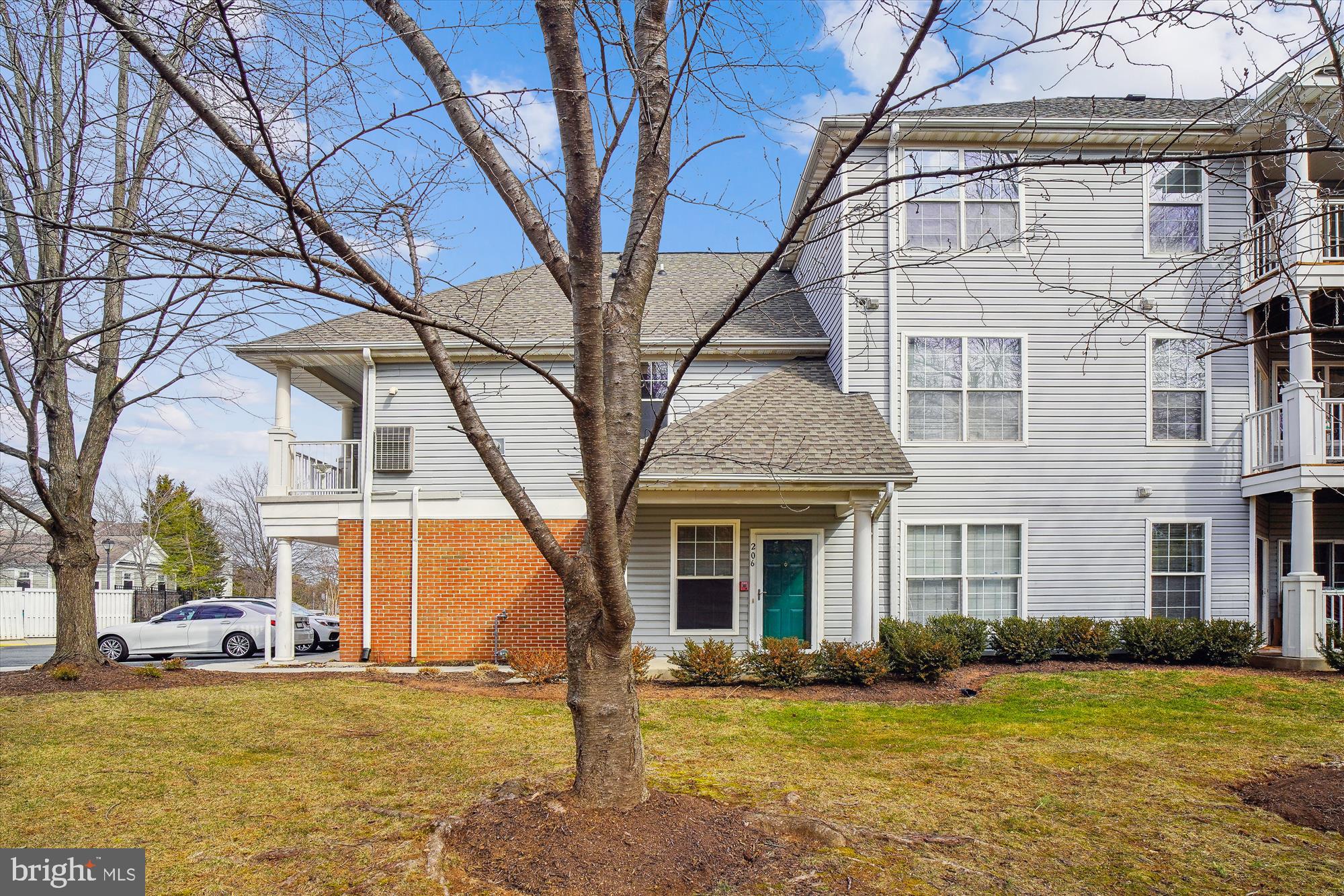 12712 Found Stone Road, Unit 4206 Germantown, MD 20876 - Photo 1 of 58 a front view of a house with a yard