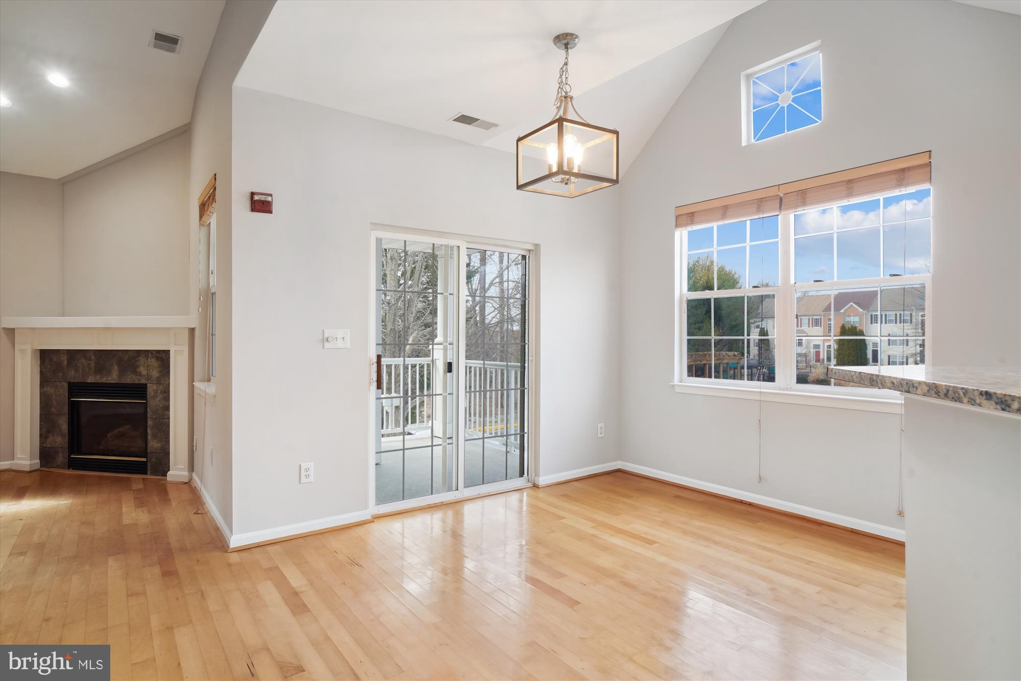 12712 Found Stone Road, Unit 4206 Germantown, MD 20876 - Photo 11 of 58 a view of an empty room with wooden floor and a window