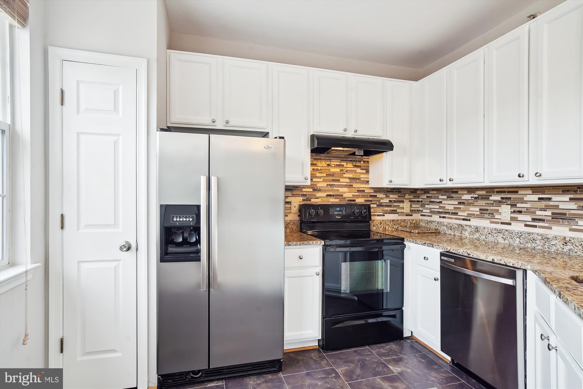 12712 Found Stone Road, Unit 4206 Germantown, MD 20876 - Photo 14 of 58 a kitchen with stainless steel appliances granite countertop a refrigerator and a stove