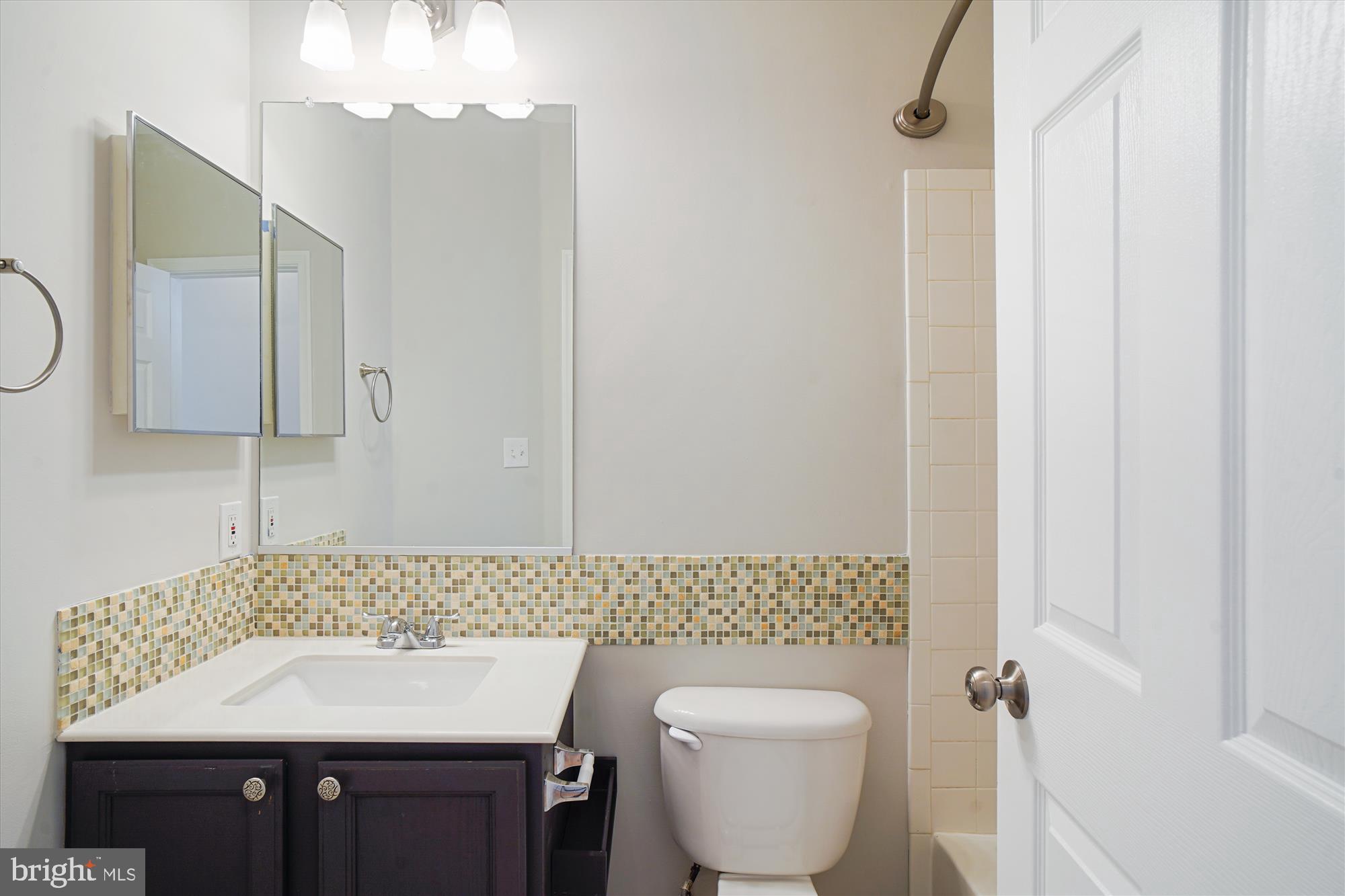 12712 Found Stone Road, Unit 4206 Germantown, MD 20876 - Photo 17 of 58 a bathroom with a toilet a sink and mirror