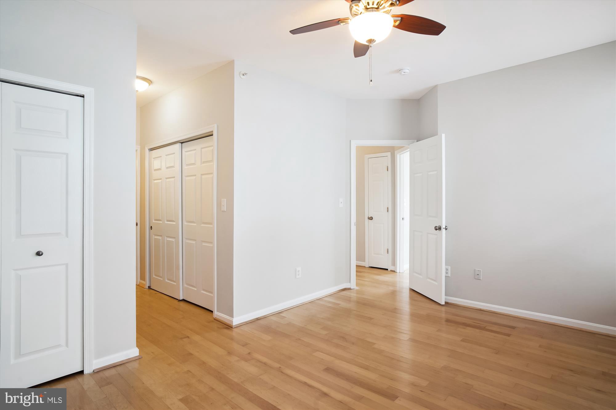 12712 Found Stone Road, Unit 4206 Germantown, MD 20876 - Photo 24 of 58 an empty room with closet and a chandelier fan