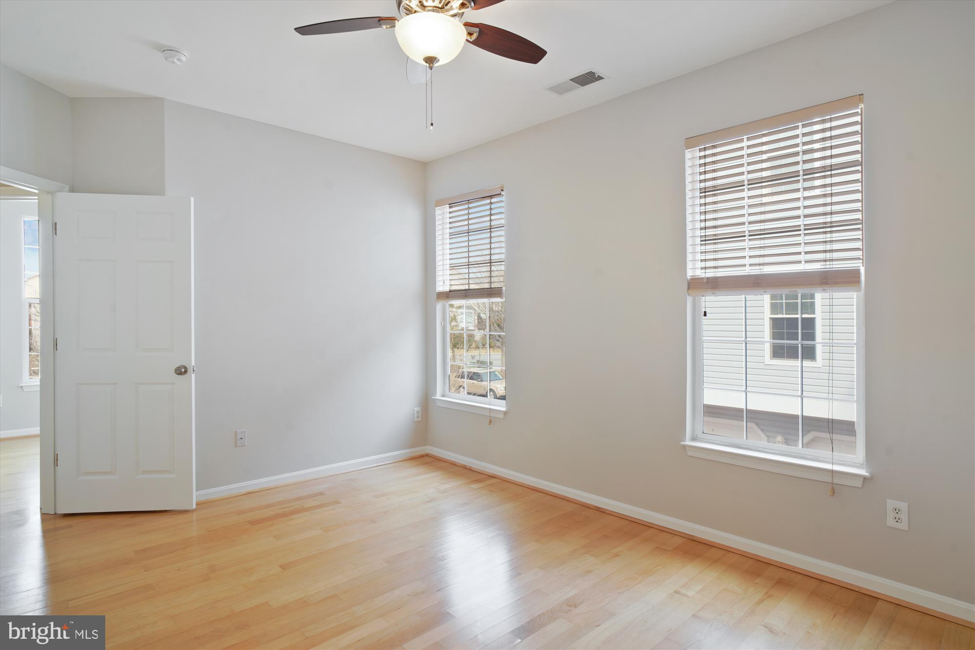 12712 Found Stone Road, Unit 4206 Germantown, MD 20876 - Photo 25 of 58 a view of an empty room with a window and wooden floor