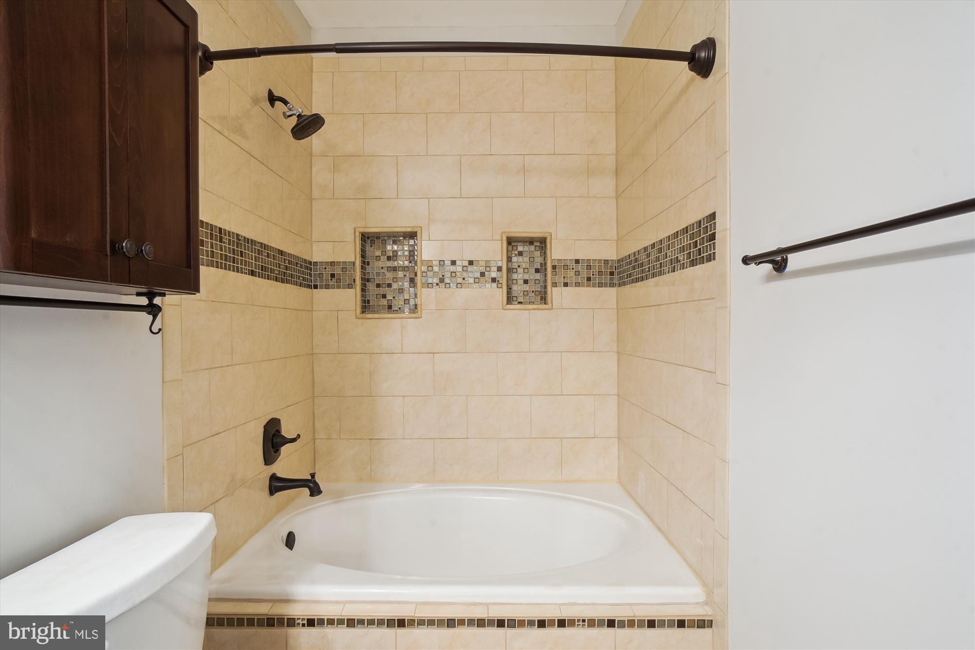 12712 Found Stone Road, Unit 4206 Germantown, MD 20876 - Photo 27 of 58 a bathroom with a bath tub and a shower