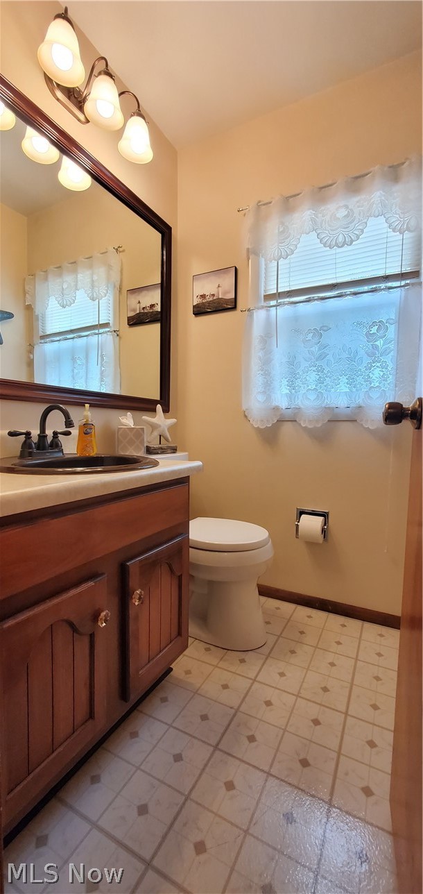 1515 East Bogart Road Sandusky, OH 44870 - Photo 15 of 23 Bathroom featuring tile patterned flooring, toilet, and vanity