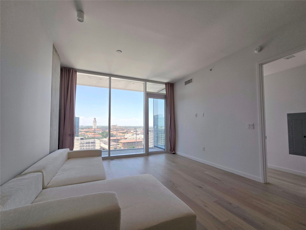 313 West 17th Street, Unit 1802 Austin, TX 78701 - Photo 13 of 24 a living room with a large window