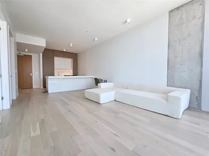 a spacious bedroom with a bed and a couch