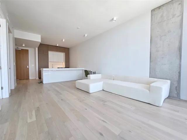 a spacious bedroom with a bed and a couch