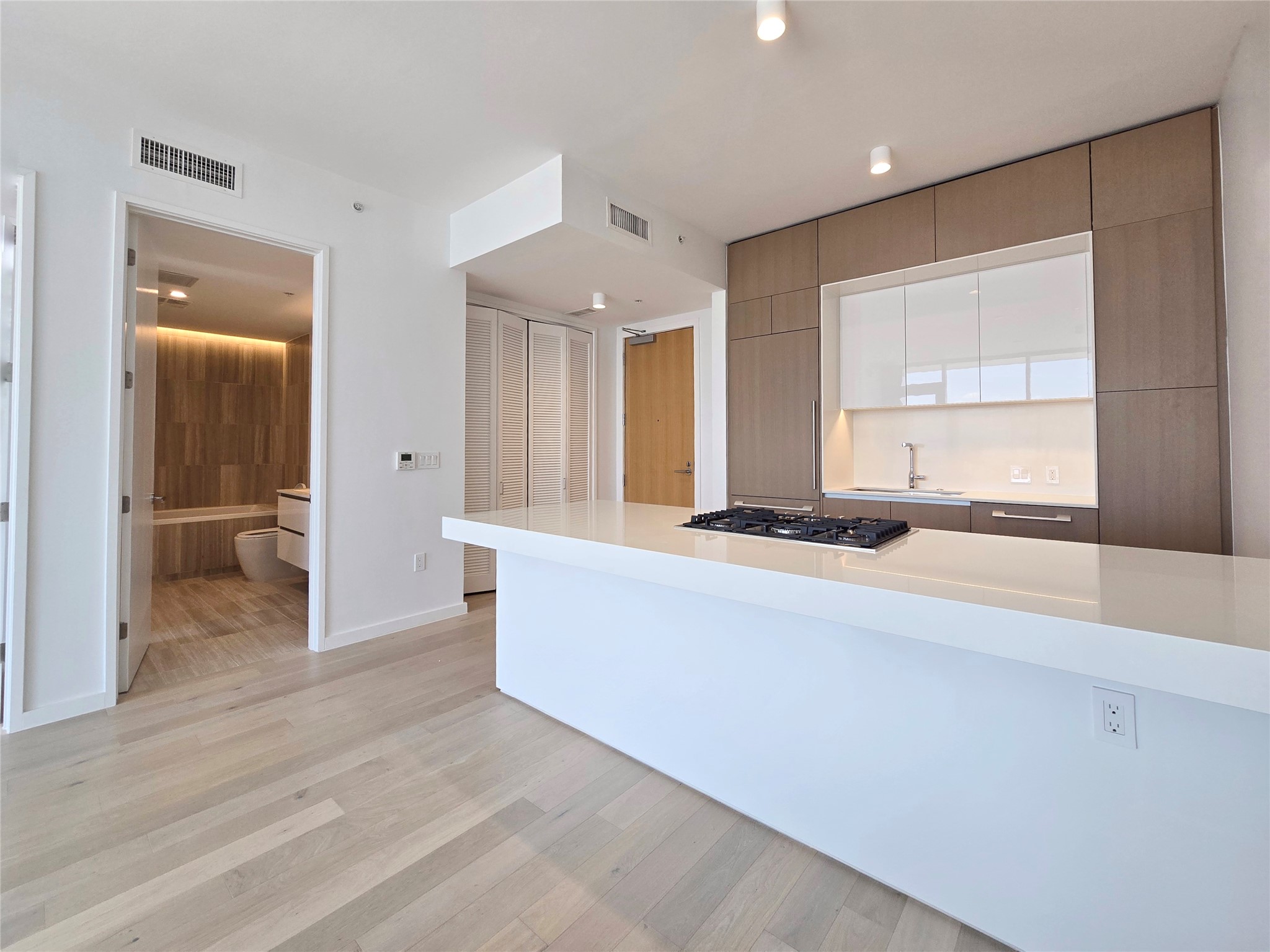 313 West 17th Street, Unit 1802 Austin, TX 78701 - Photo 17 of 24 a living room with stainless steel appliances kitchen island granite countertop furniture and a large window