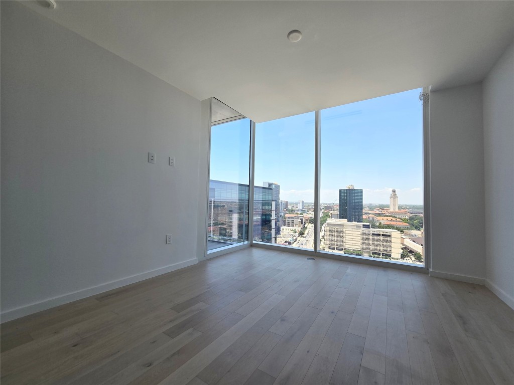 313 West 17th Street, Unit 1802 Austin, TX 78701 - Photo 4 of 24 a view of a room with wooden floor