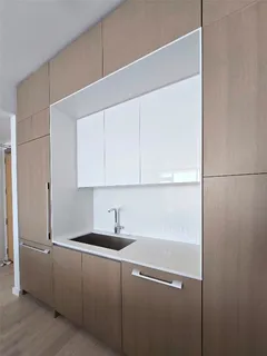 a kitchen with a sink and cabinets