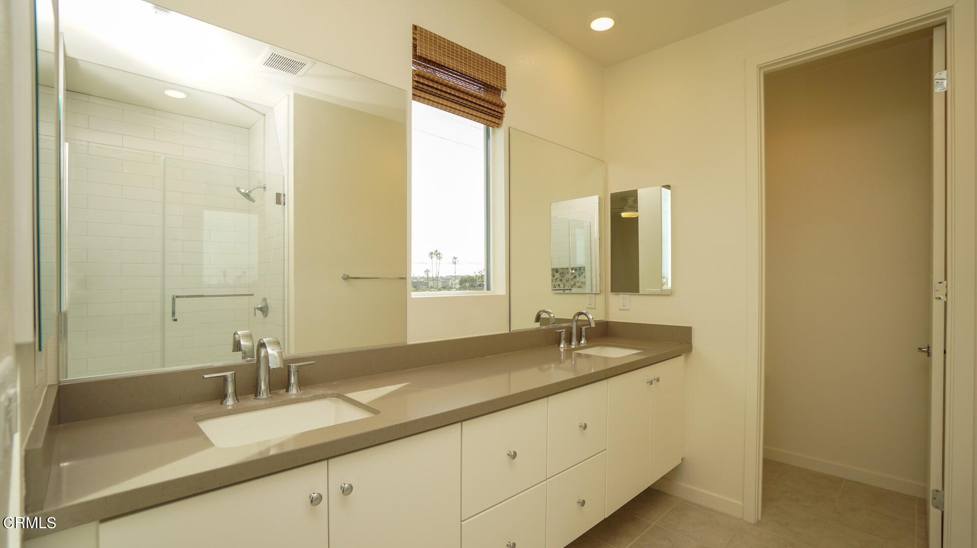 1063 Canal Street Oxnard, CA 93035 - Photo 15 of 32 a bathroom with a sink double vanity and a mirror