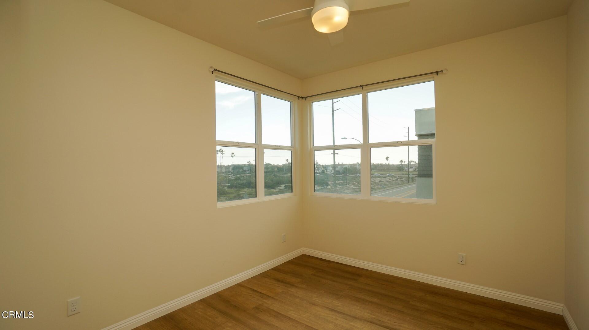 1063 Canal Street Oxnard, CA 93035 - Photo 19 of 32 a view of empty room with wooden floor
