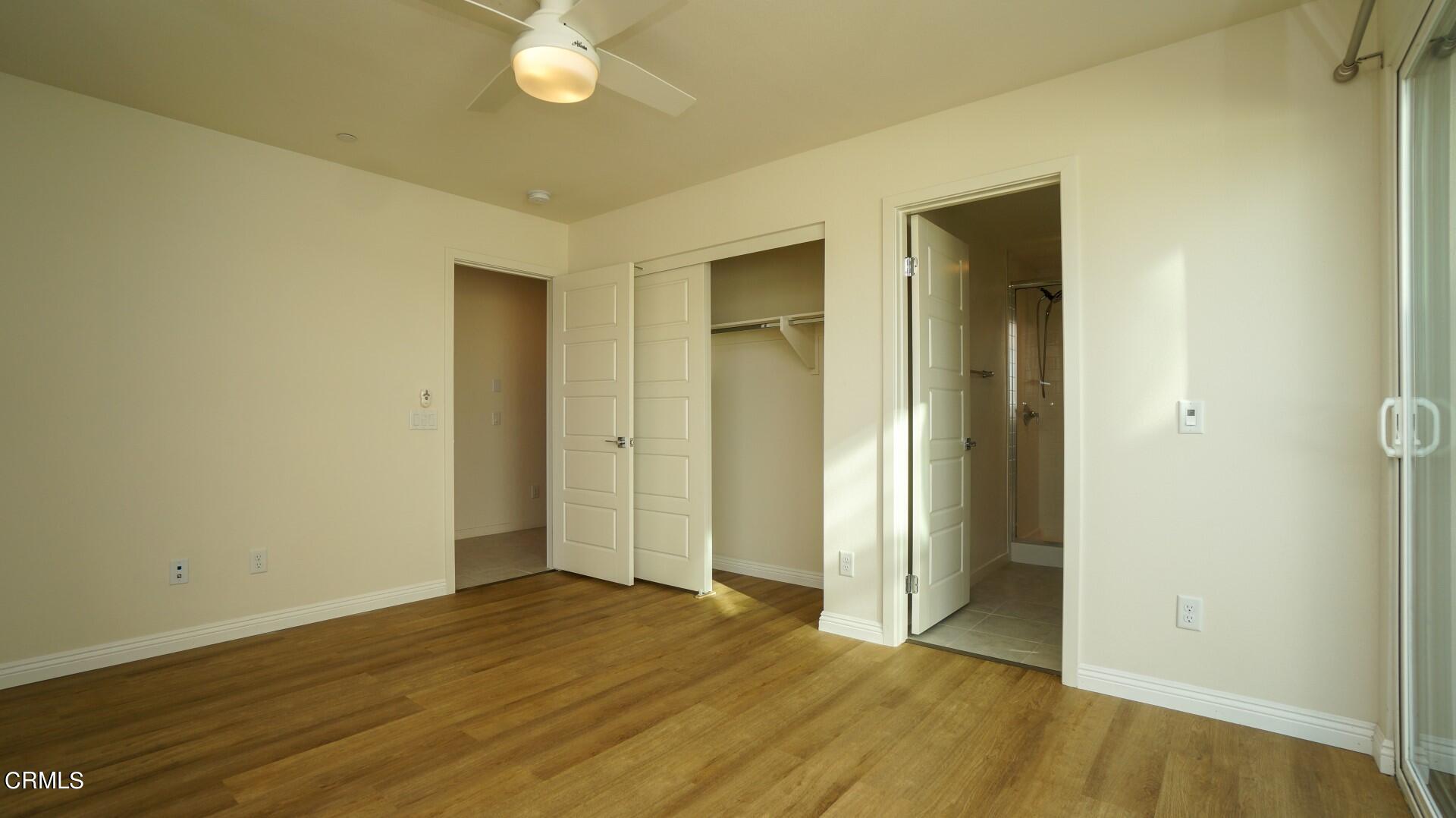 1063 Canal Street Oxnard, CA 93035 - Photo 26 of 32 a view of an empty room with wooden floor and a window