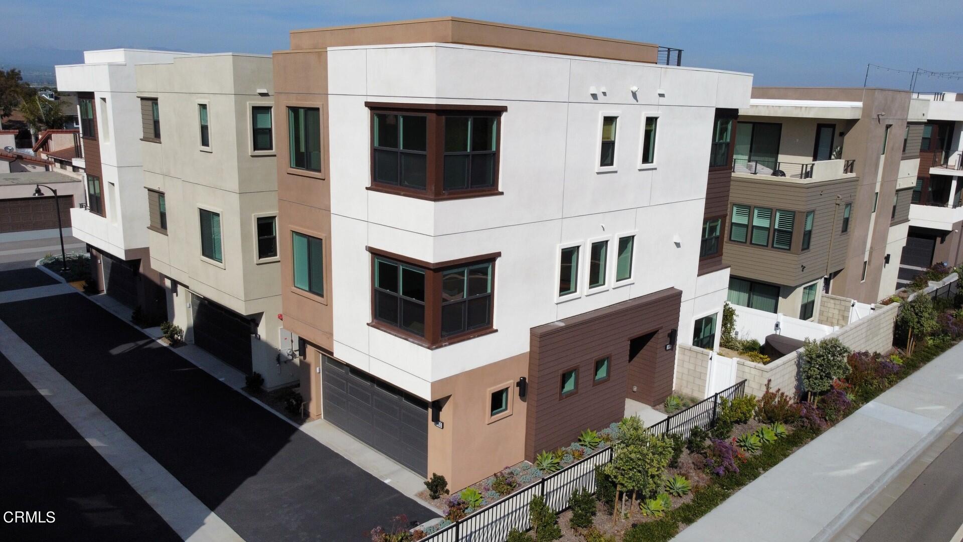 1063 Canal Street Oxnard, CA 93035 - Photo 3 of 32 a view of a large white building with many windows