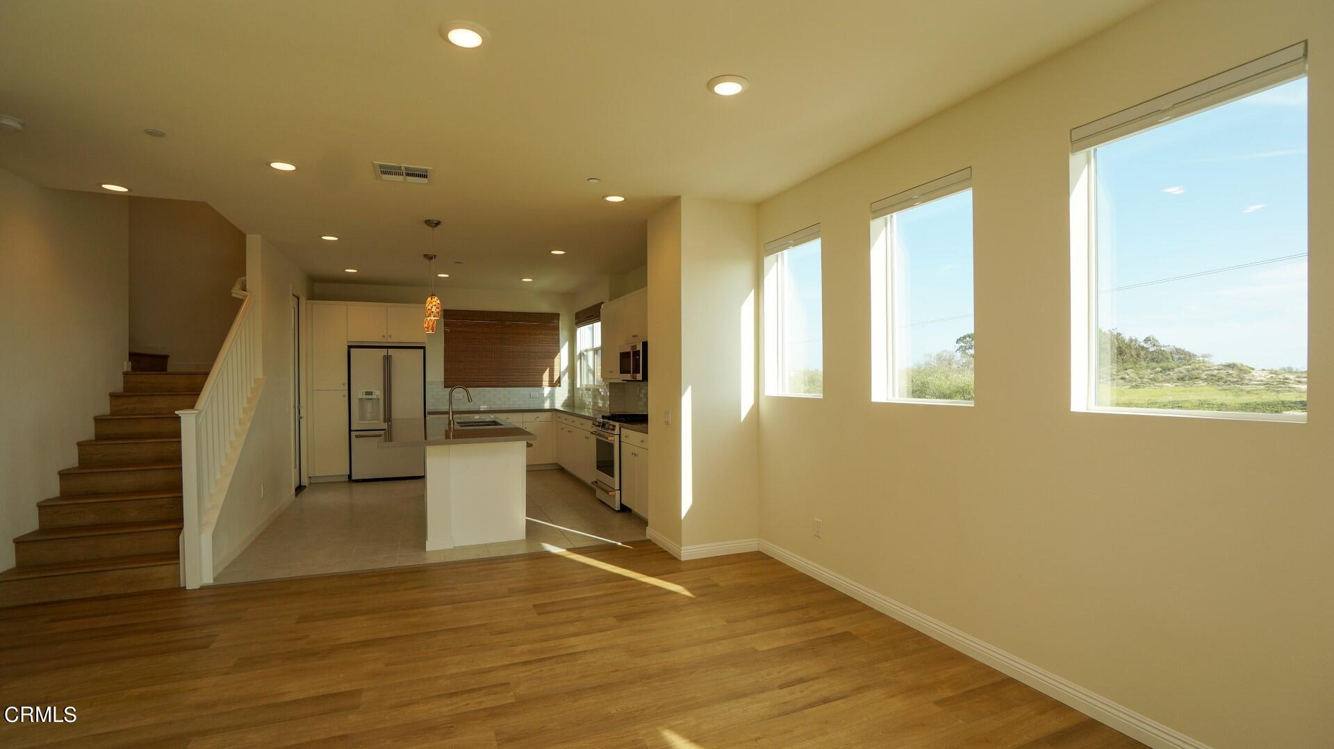 1063 Canal Street Oxnard, CA 93035 - Photo 8 of 32 a view of a kitchen with a sink and a large window