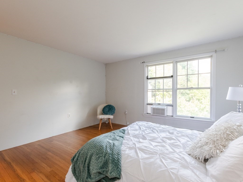 2 Columbia Road Billerica, MA 01821 - Photo 13 of 30 a bedroom with a bed and a window