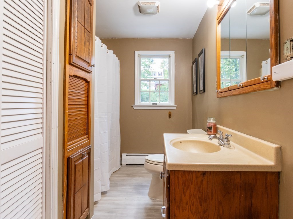 2 Columbia Road Billerica, MA 01821 - Photo 15 of 30 a bathroom with a sink a vanity and a mirror