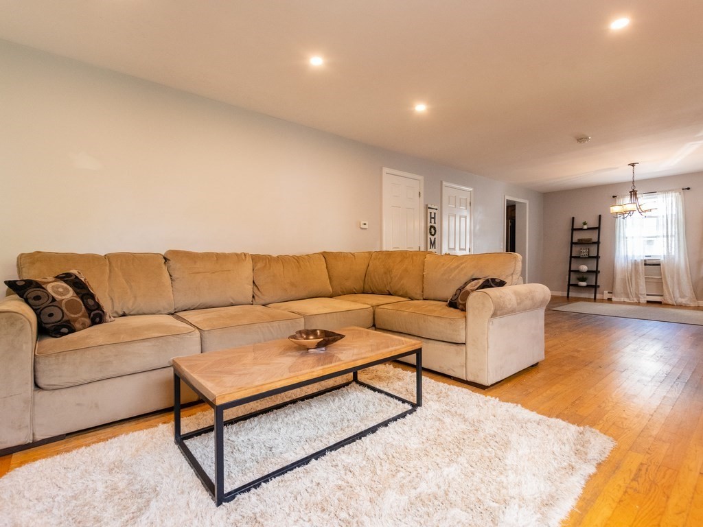 2 Columbia Road Billerica, MA 01821 - Photo 2 of 30 a living room with a couch and a coffee table
