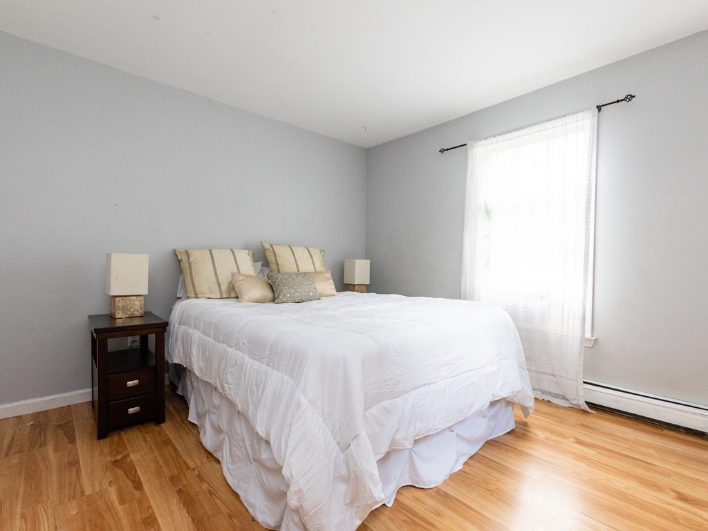 2 Columbia Road Billerica, MA 01821 - Photo 8 of 30 a bedroom with a bed and a view of a room