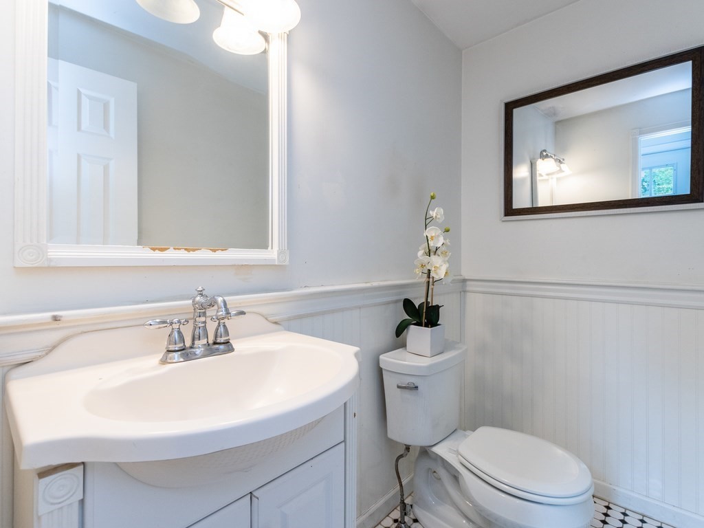 2 Columbia Road Billerica, MA 01821 - Photo 9 of 30 a bathroom with a sink a toilet and mirror