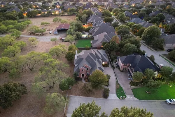 an aerial view of lake residential house with swimming pool and outdoor space