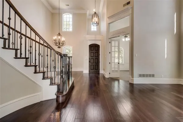 a view of entryway with wooden floor and stairs