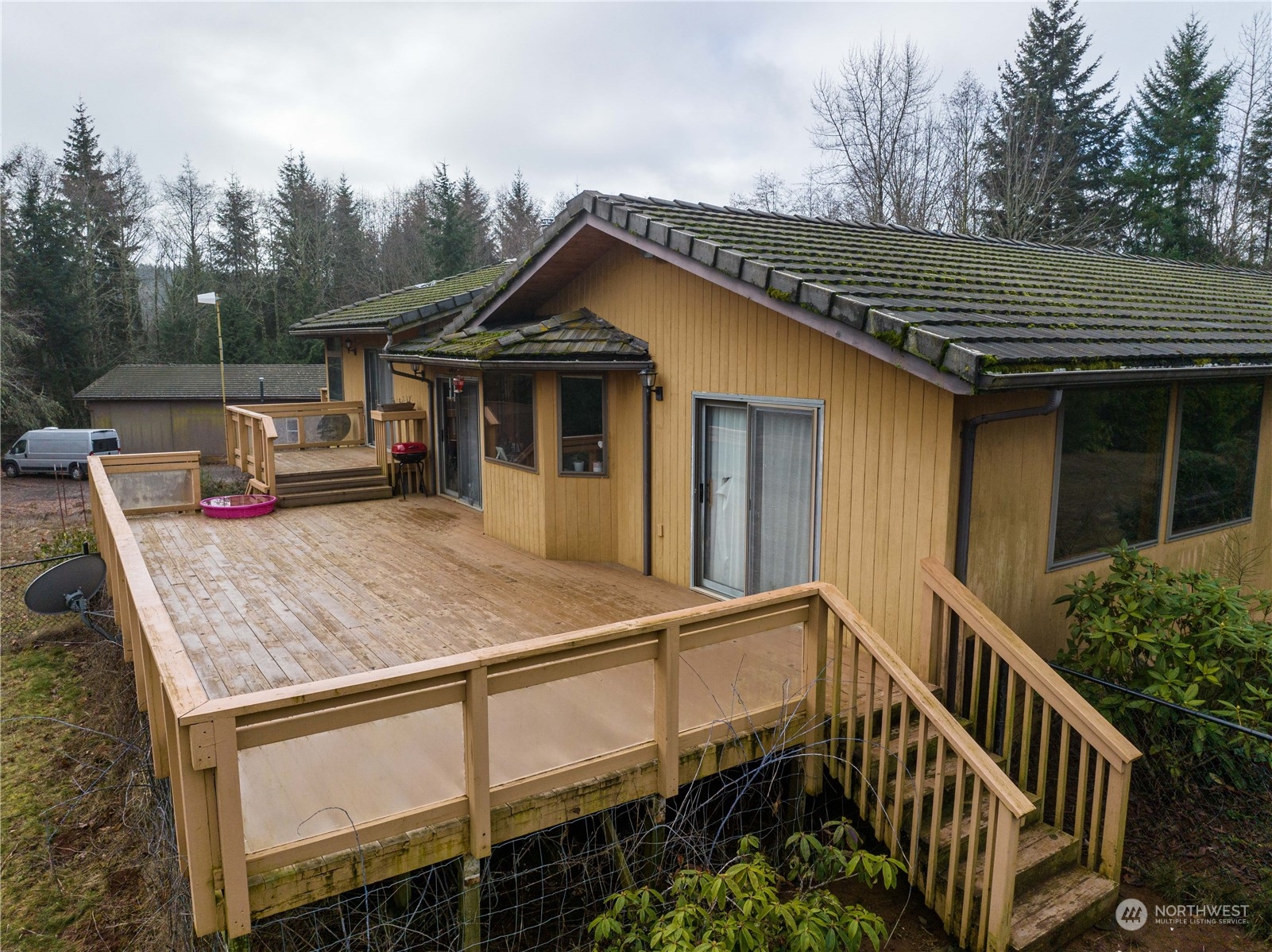 133 Ridgeview Road Chehalis, WA 98532 - Photo 23 of 32 a view of a house with wooden deck and backyard