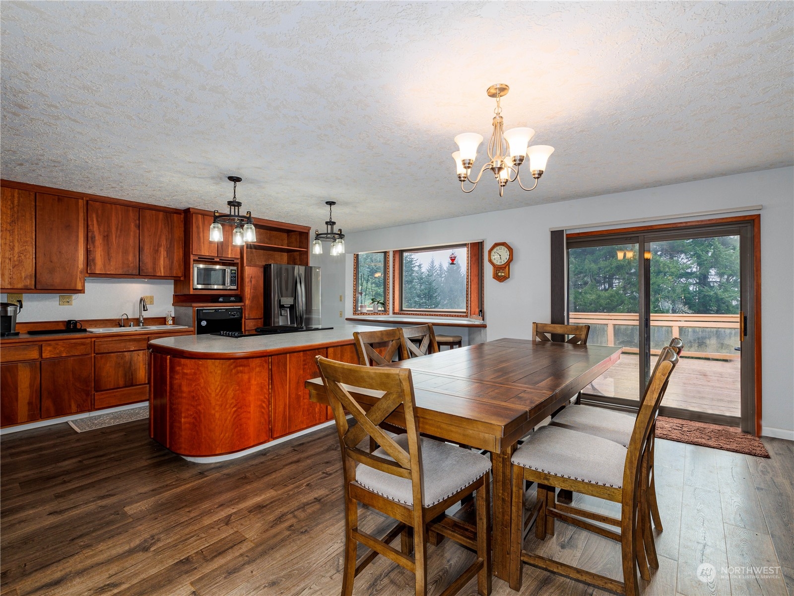 133 Ridgeview Road Chehalis, WA 98532 - Photo 3 of 32 a view of a dining room with furniture a chandelier and wooden floor