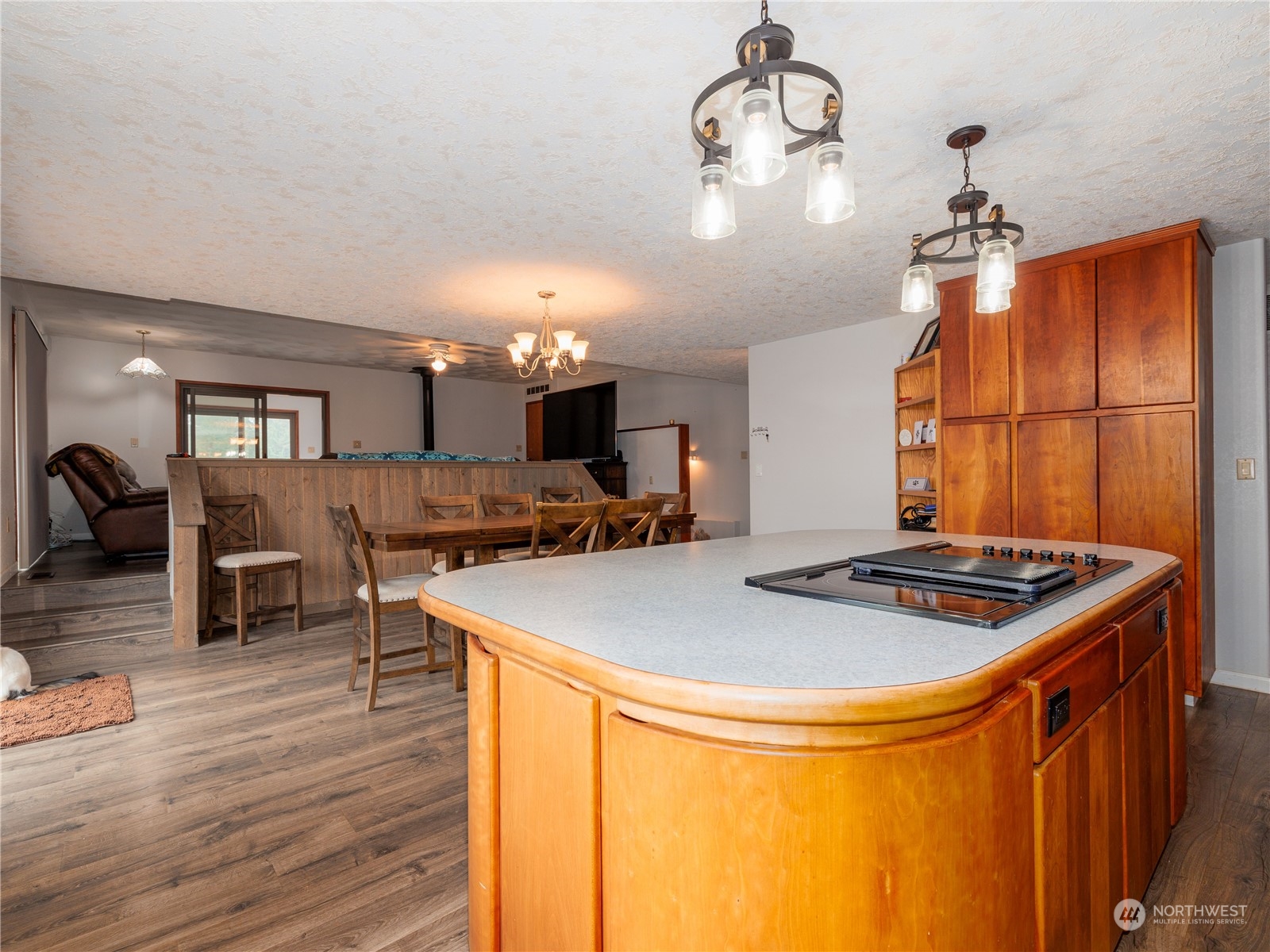133 Ridgeview Road Chehalis, WA 98532 - Photo 6 of 32 a kitchen with stainless steel appliances granite countertop a sink a stove and chairs with wooden floor