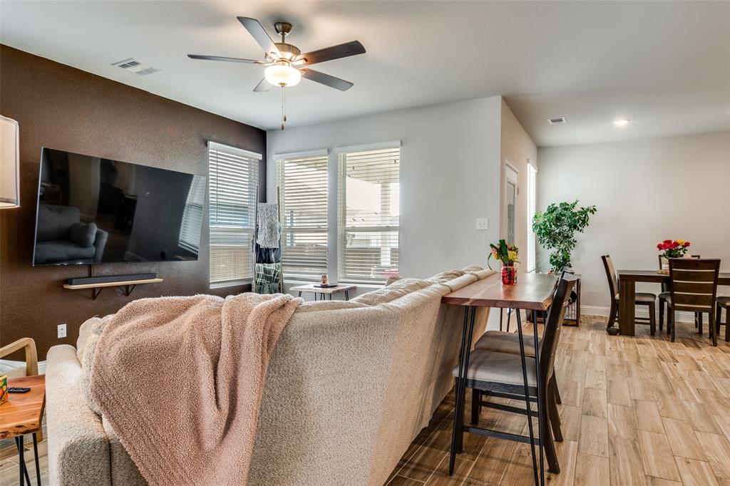 8413 Alba Lane Rowlett, TX 75089 - Photo 6 of 25 Living area featuring light wood-style floors and ceiling fan