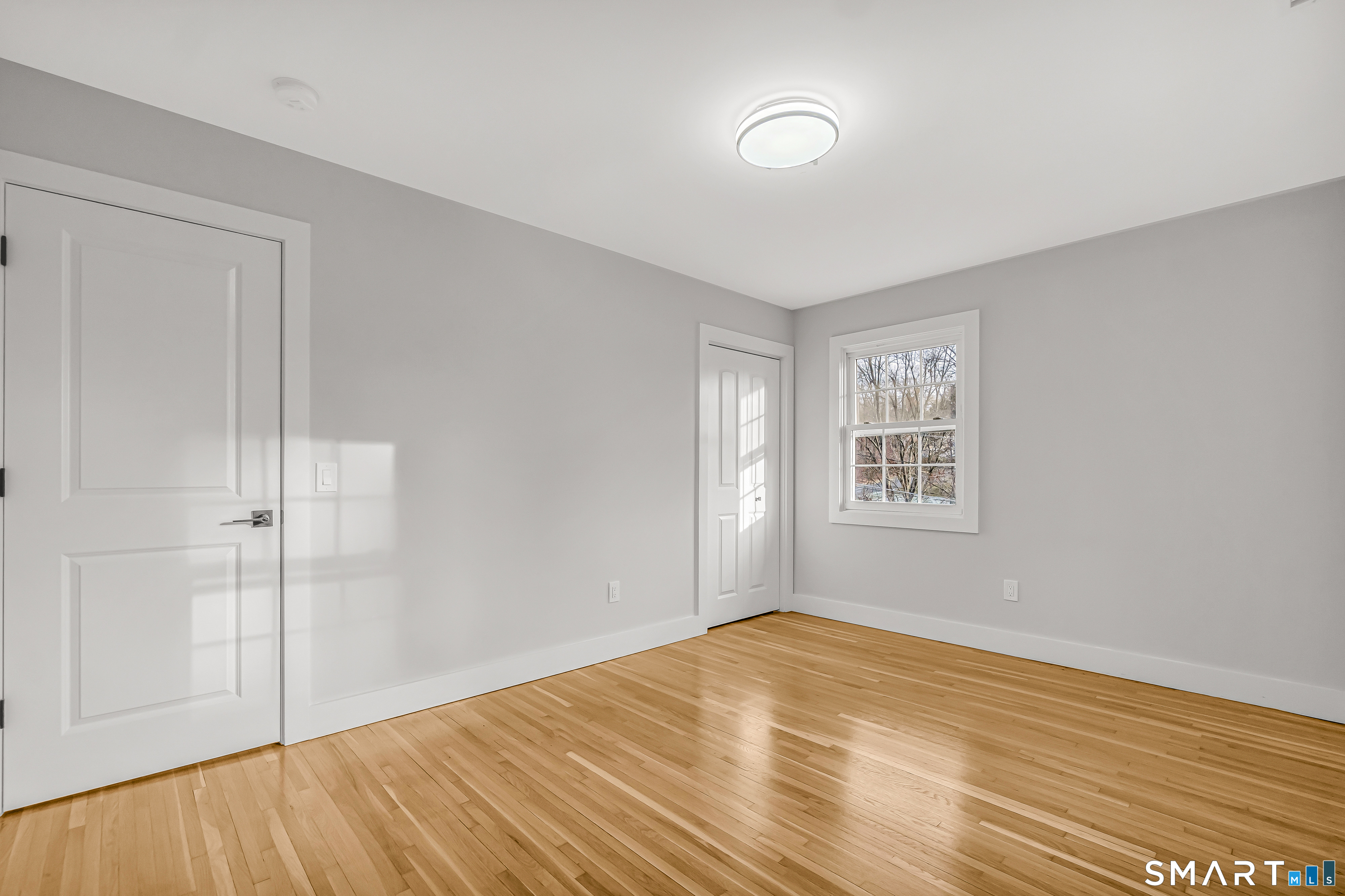 2 Rolf Drive Danbury, CT 06810 - Photo 23 of 32 a view of empty room with wooden floor and fan