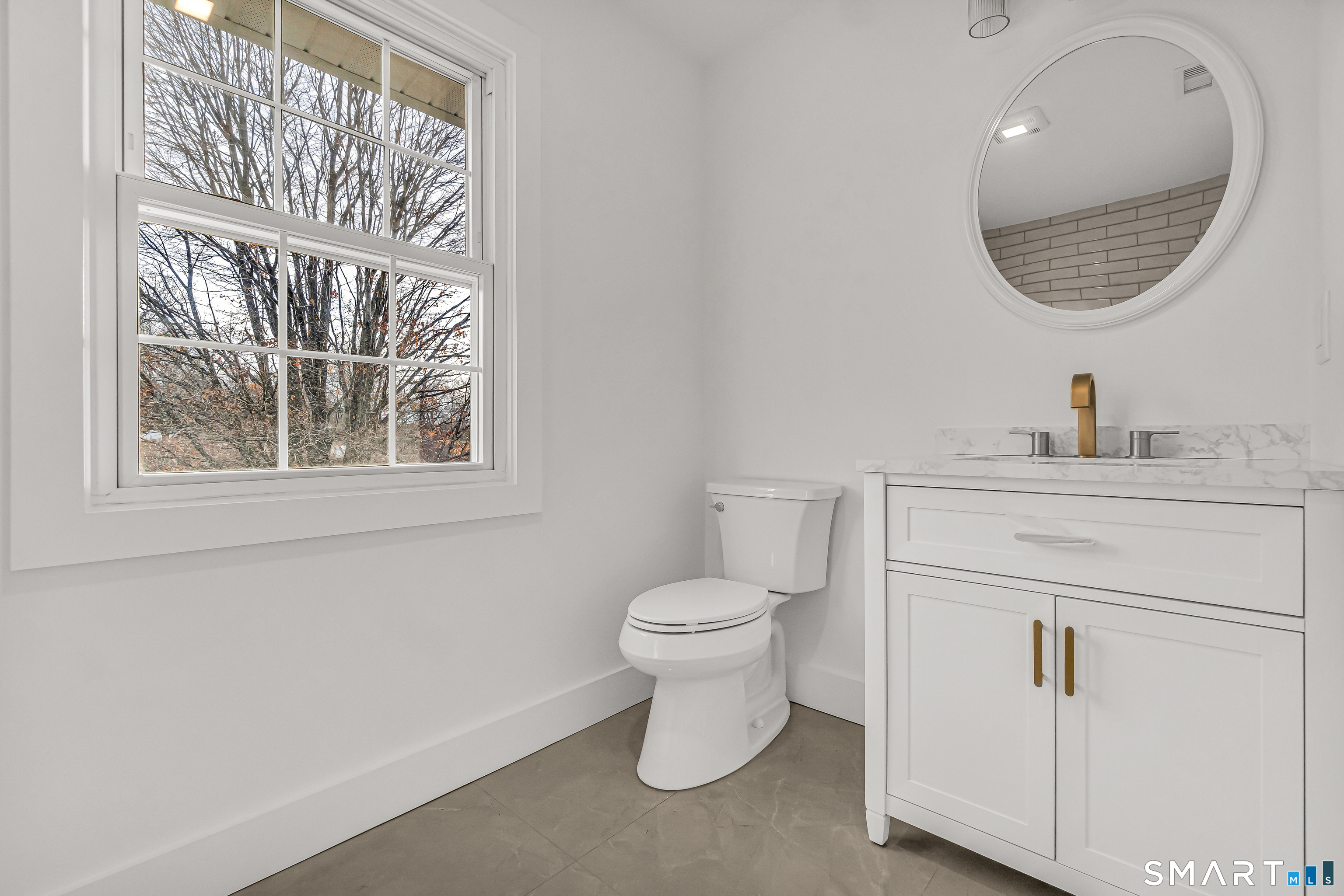 2 Rolf Drive Danbury, CT 06810 - Photo 25 of 32 a bathroom with a toilet a sink and a mirror