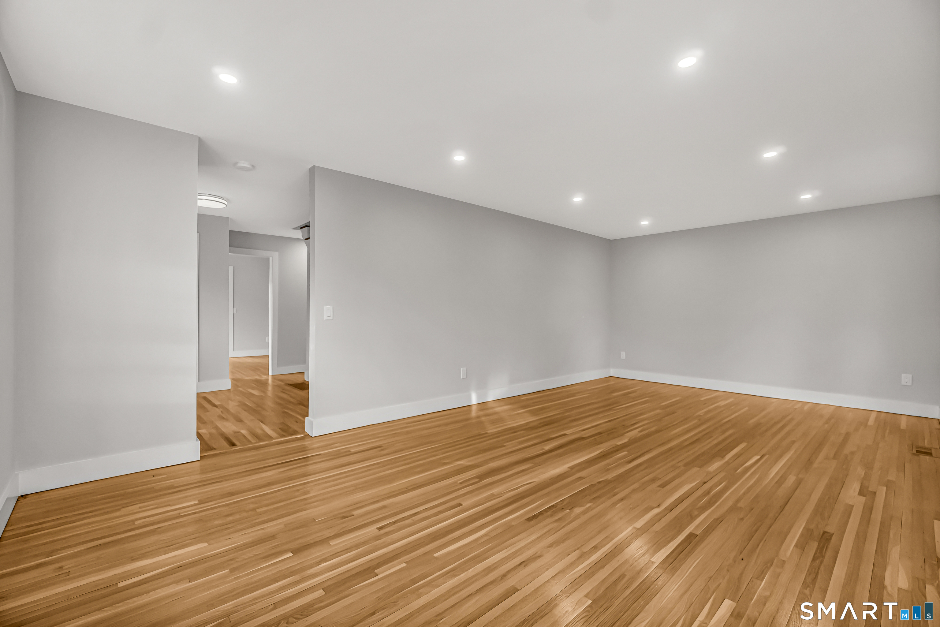 2 Rolf Drive Danbury, CT 06810 - Photo 3 of 32 a view of empty room with wooden floor