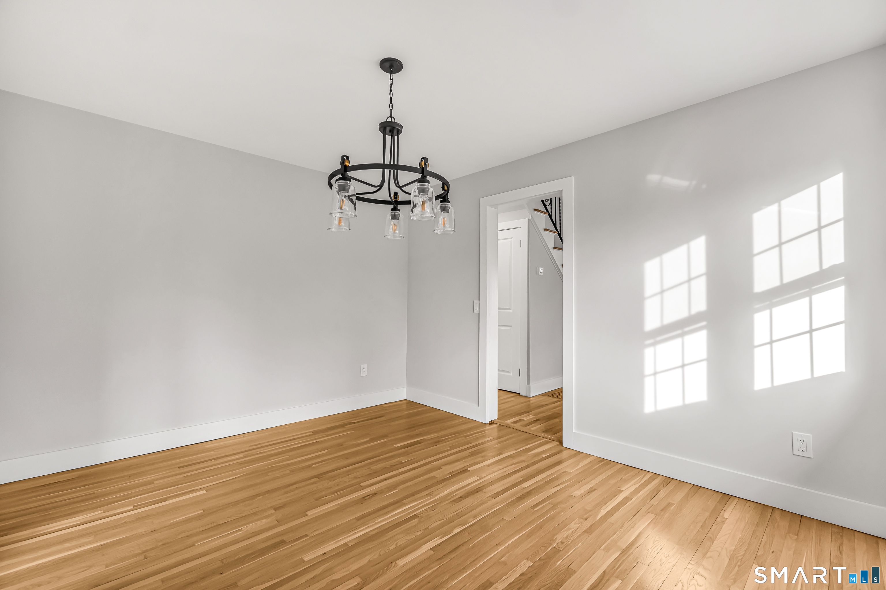 2 Rolf Drive Danbury, CT 06810 - Photo 6 of 32 a view of empty room with wooden floor and fan
