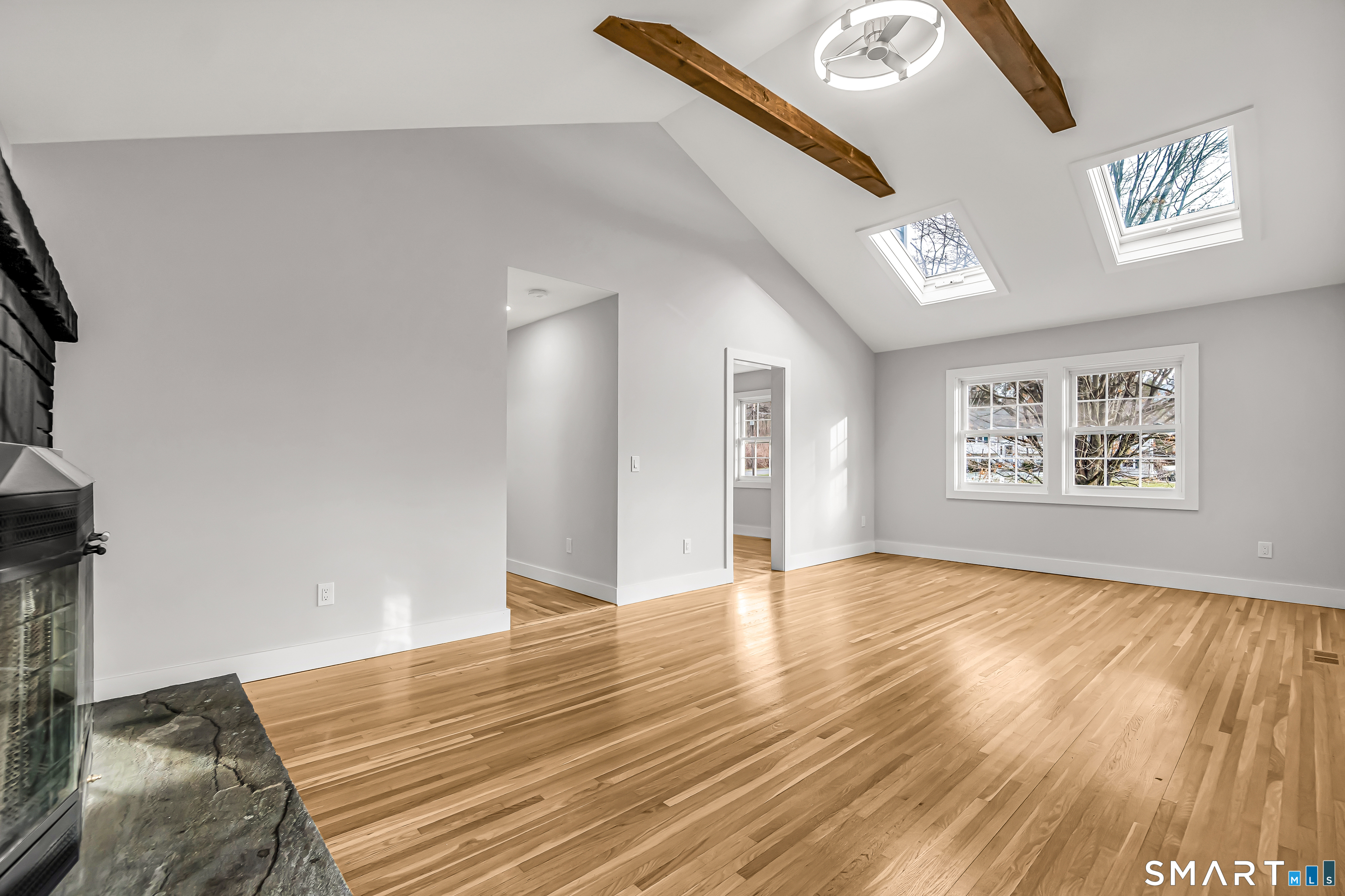 2 Rolf Drive Danbury, CT 06810 - Photo 9 of 32 a view of an empty room with wooden floor and a window