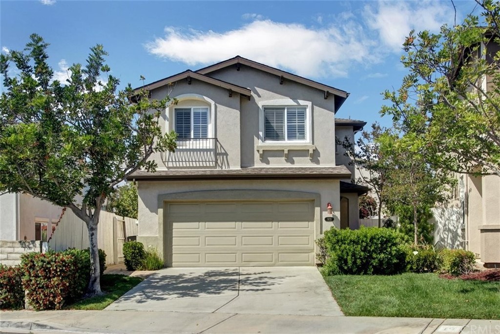 973 Thicket Drive Carson, CA 90746 - Photo 1 of 32 a front view of a house with a garden and plants